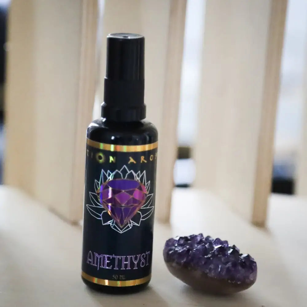 Amethyst Mist spray bottle with purple lotus design and black label