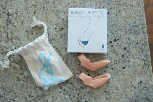 Bunion Busters kit with pink silicone pads in white packaging for foot health