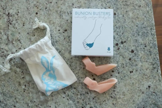 Bunion Busters kit with pink silicone pads in white packaging for foot health