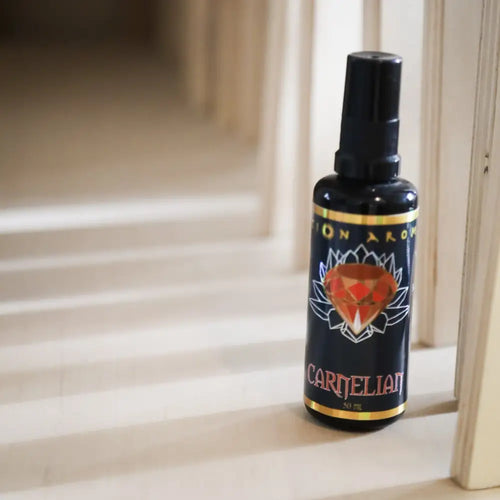 Carnelian Mist black spray bottle with red gold label and diamond design