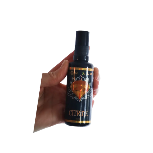 Citrine Mist black spray bottle with gold and orange design