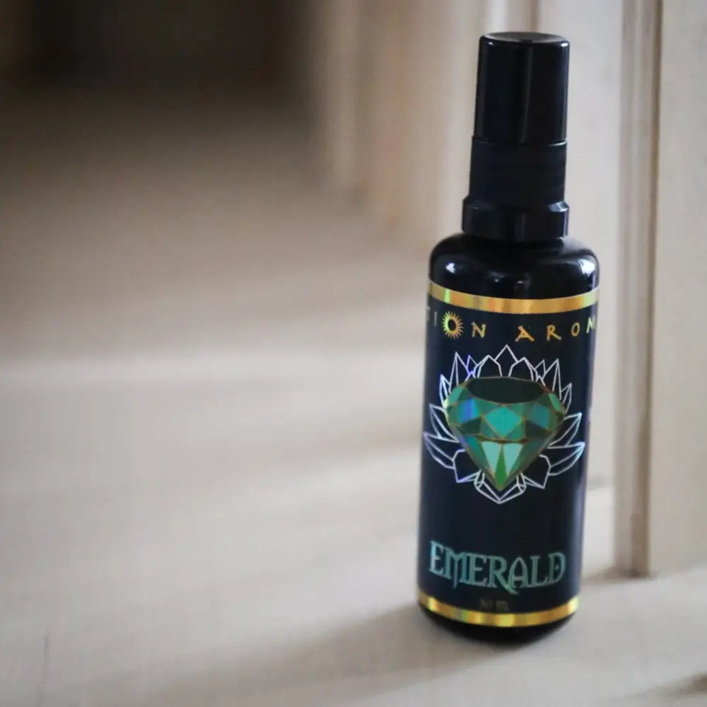 Emerald Mist spray bottle in green with lotus label