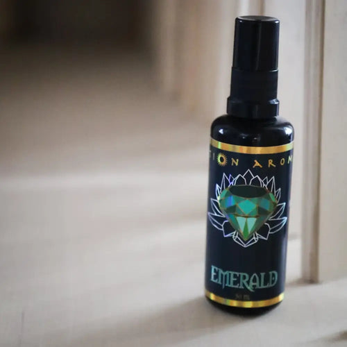 Emerald Mist spray bottle in green with lotus label