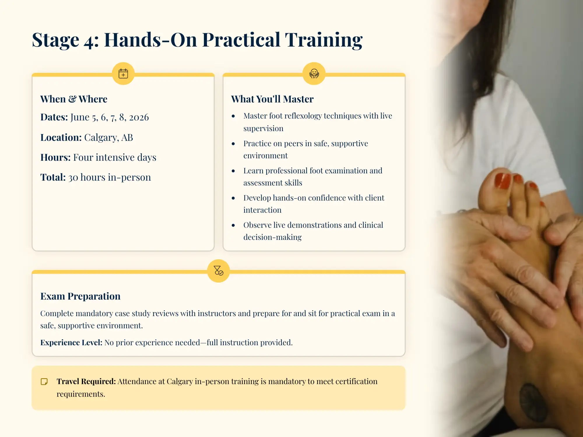 A woman with dark hair and red nail polish gently holds a foot during a professional massage or reflexology session.